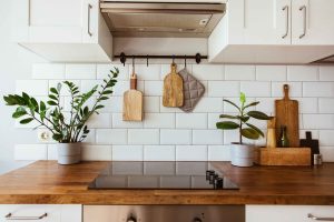 hanging-kitchen-with-white-tiles-wall-and-wood-tab-scaled