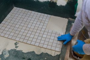 troweling-mortar-a-concrete-floor-in-preparation