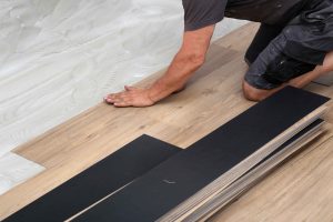worker-installing-new-vinyl-tile-floor-2025